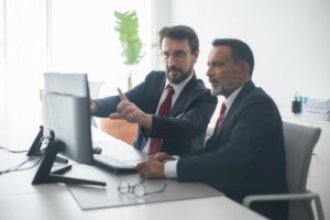 Scott Lippitt two men facing the computer together